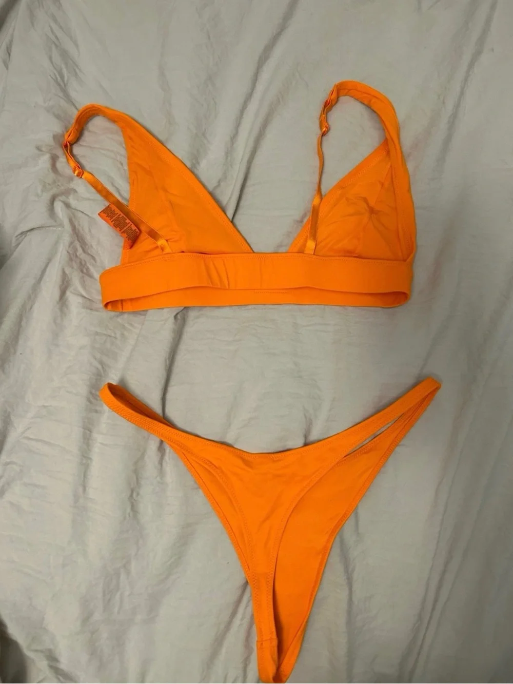 SKIMS Vibrant Orange Deep-V Bikini Top and Bottoms